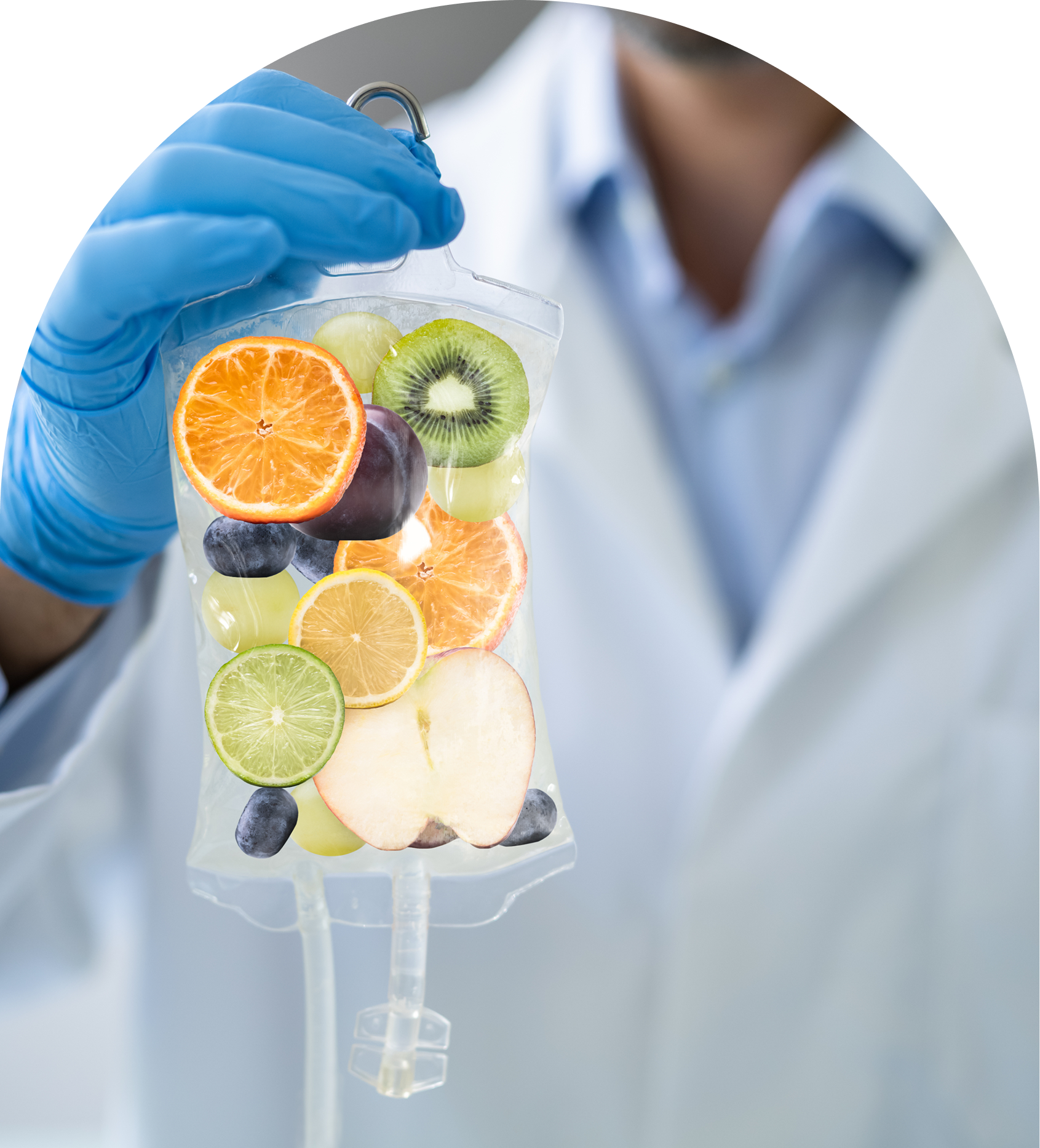 Fruits in IV bag held by scientist.